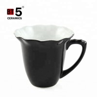 Special ceramic flower shape handle black mug for sale